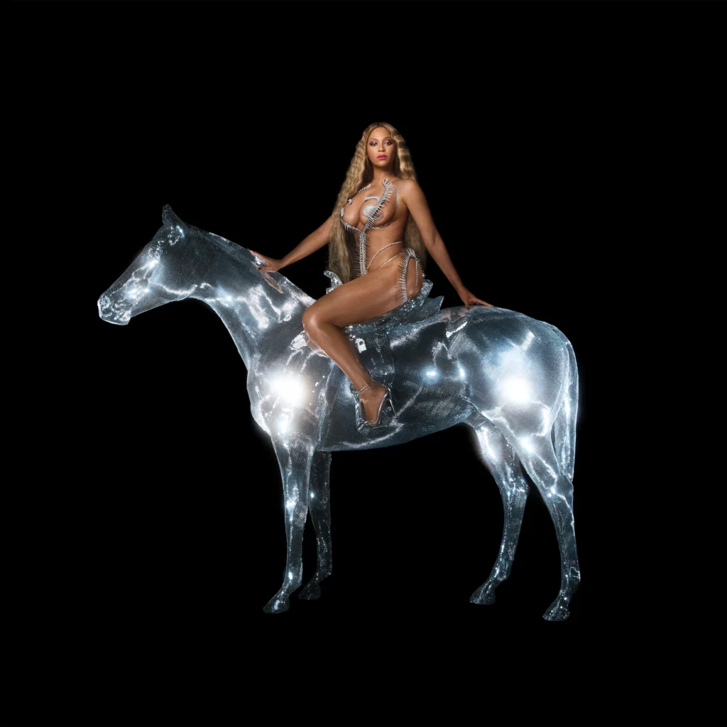 A women in sparkly clothing sits on a glowing horse against a black background. 