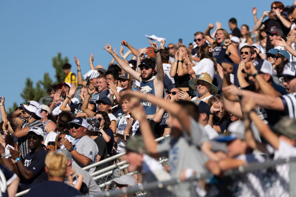 Students of UNR scream for the Nevada Football team