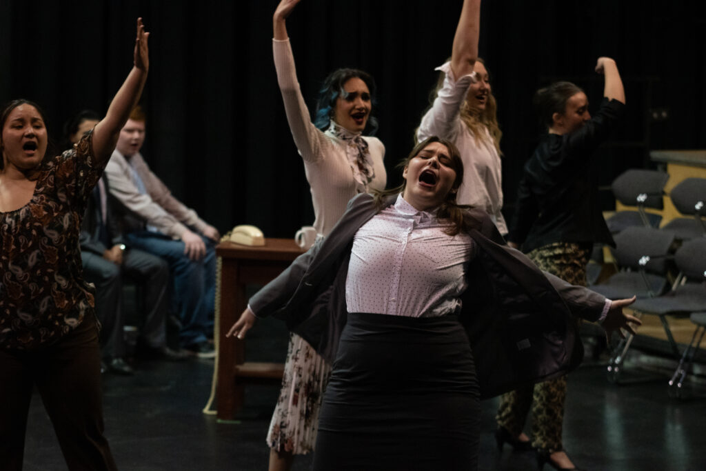 Cast members in 9 to 5 mid-musical number.