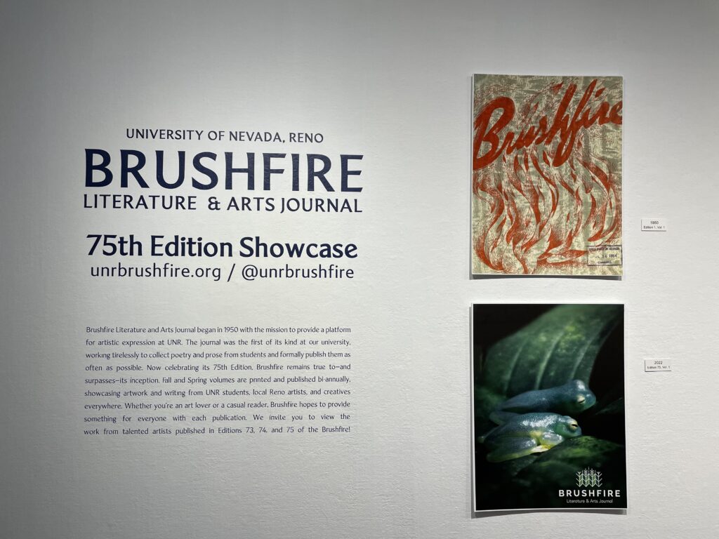 A gallery wall that reads: "Brushfire Literature and Arts Journal: 75th Edition Showcase."