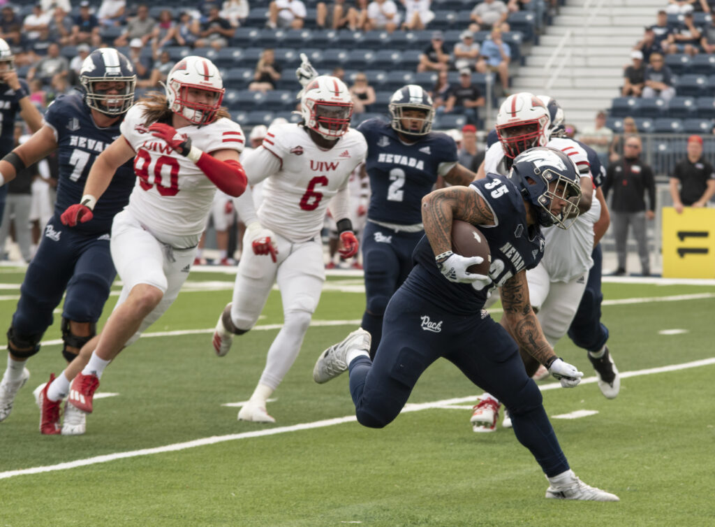 A player runs with the ball to the end zone