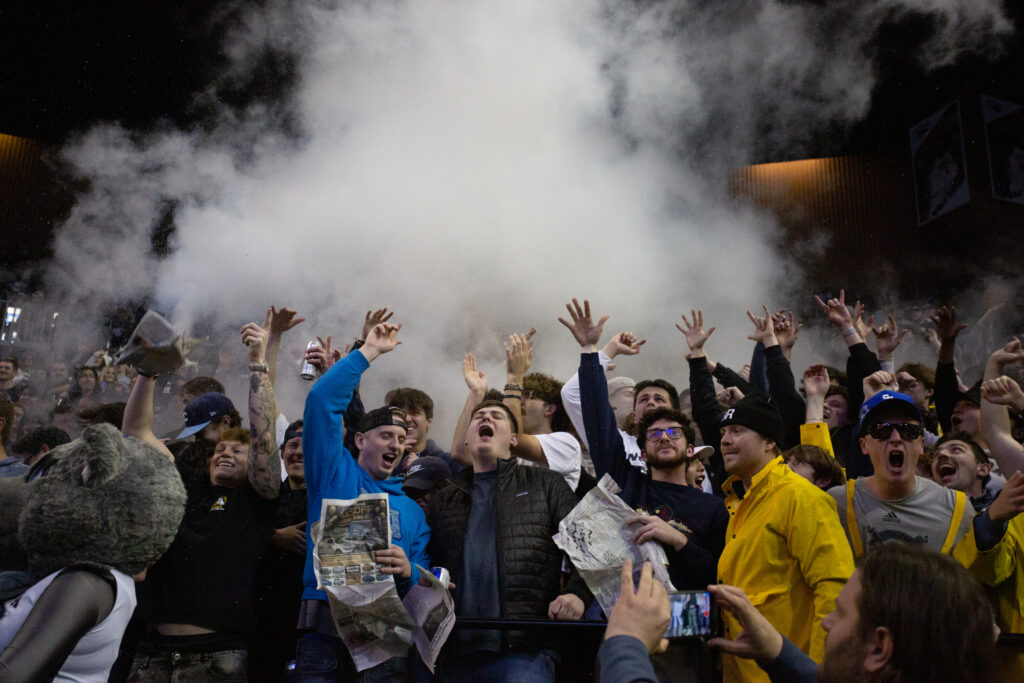 Students celebrate in the student section at the UNR v SDSU game