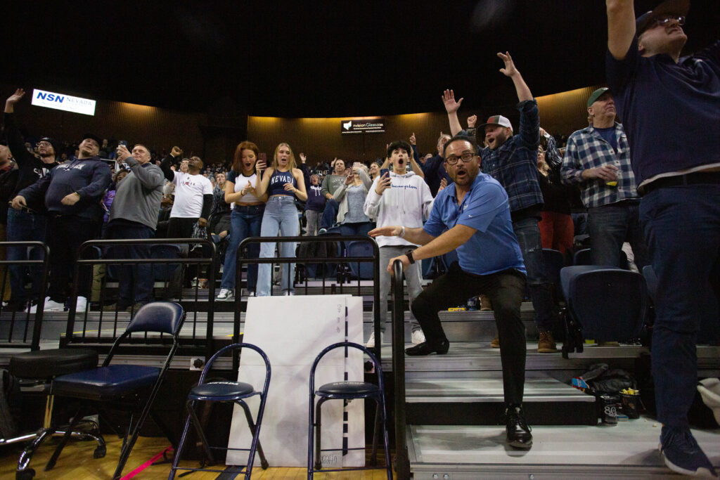 Fans hold onto the railing in shock at the UNR v. SDSU game