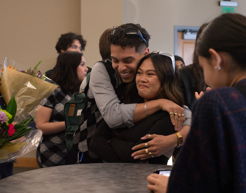 A photo of Boris Carpio Guerra hugs Hannah Alquiza after being announced as ASUN president for the 2023-2024 school year.