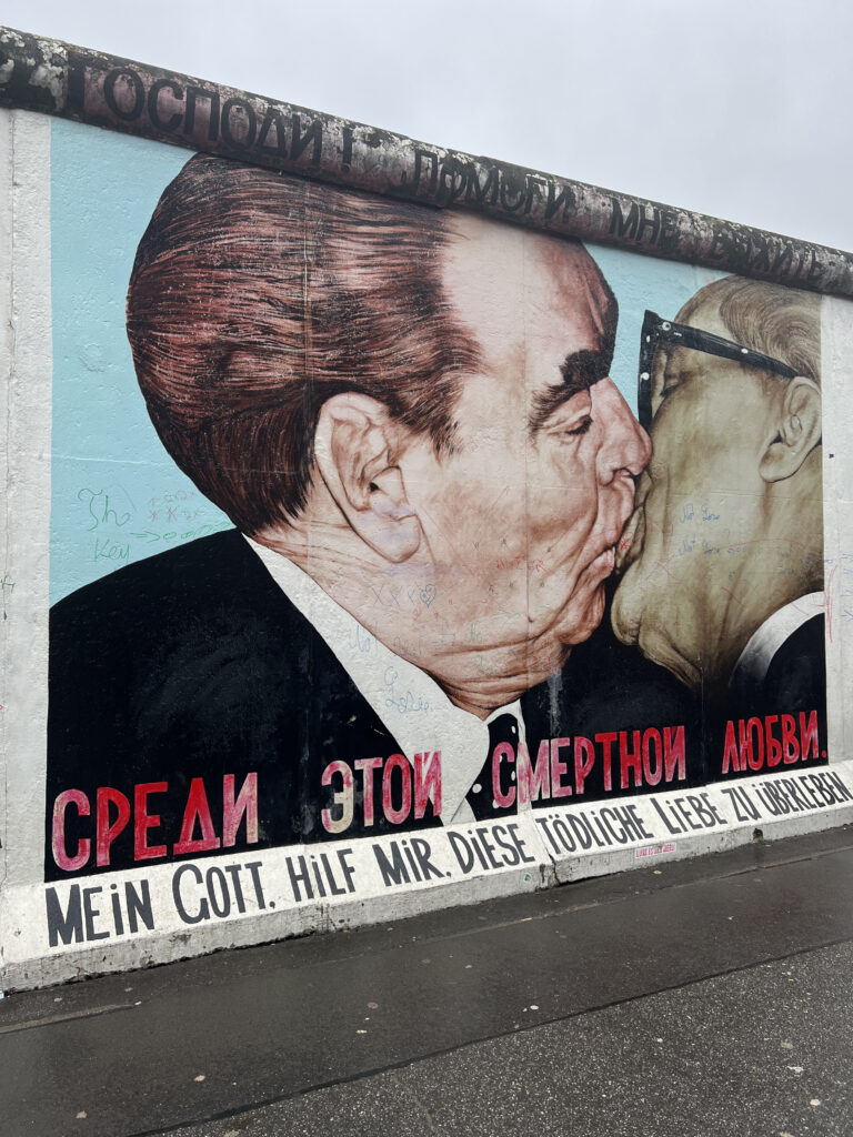 Iconic Berlin mural of two men kissing