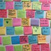 A wall of sticky notes with supportive messages inside the UndocuPack office.