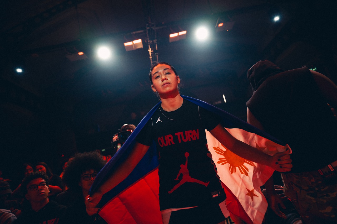 Individual posing with the Filipino flag