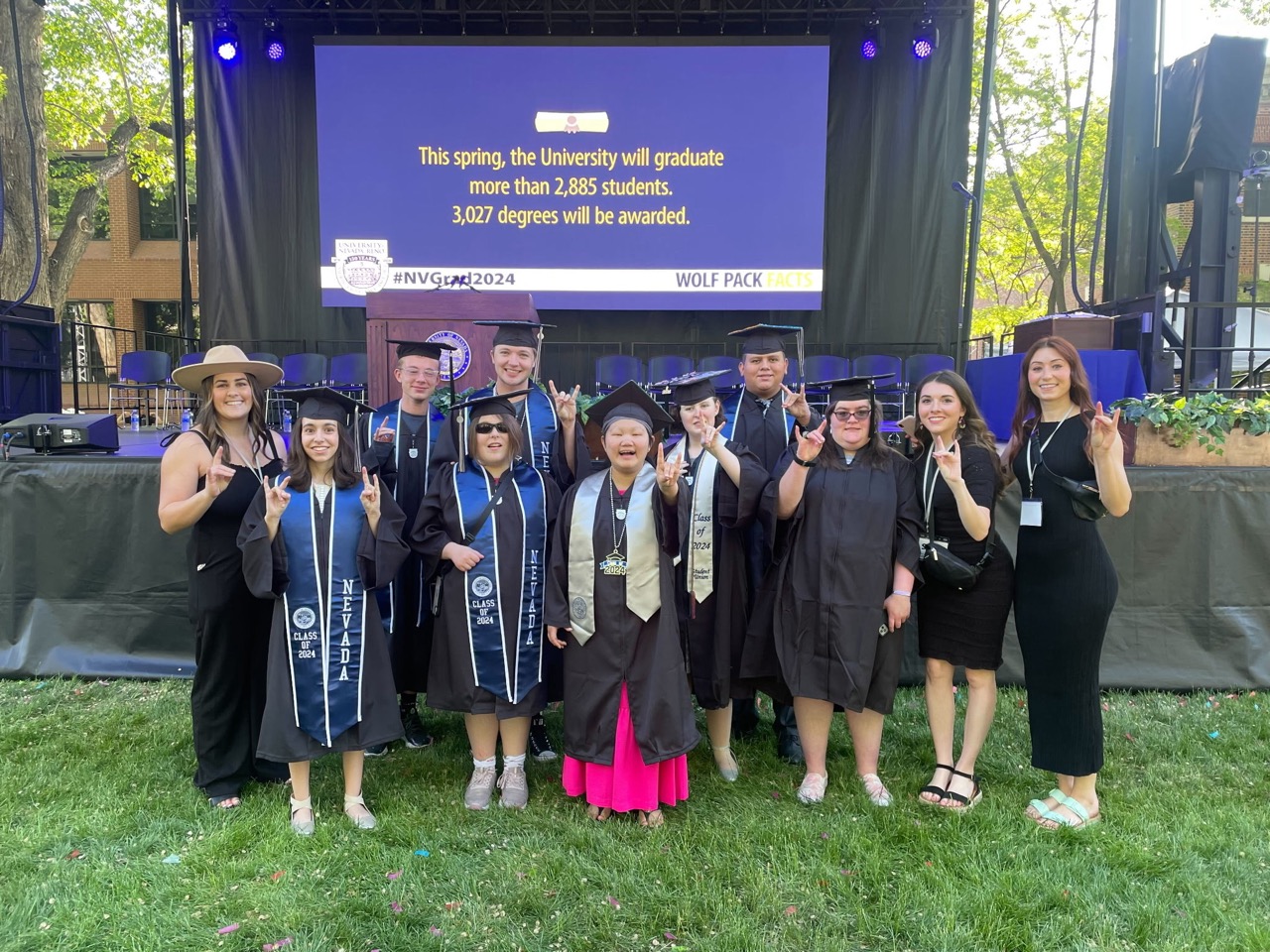 A photo of the Path to Independence program’s graduating class of 2024. Via Fong is in the middle in a pink dress and a silver necklace with a Class of 2024 pendant.