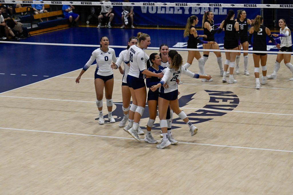 The Nevada volleyball team celebrates a big point.