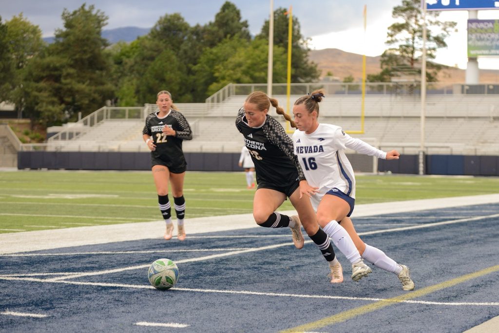 Wolf Pack forward Olivia Loomis (#16) takes on a Lumberjacks defender on Thursday, Sept. 3 at Mackay Stadium.