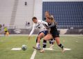 Nevada forward Carmen Coronado (#5) takes on two Northern Arizona defenders on Thursday, Sept. 3 at Mackay Stadium