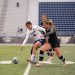 Nevada forward Carmen Coronado (#5) takes on two Northern Arizona defenders on Thursday, Sept. 3 at Mackay Stadium