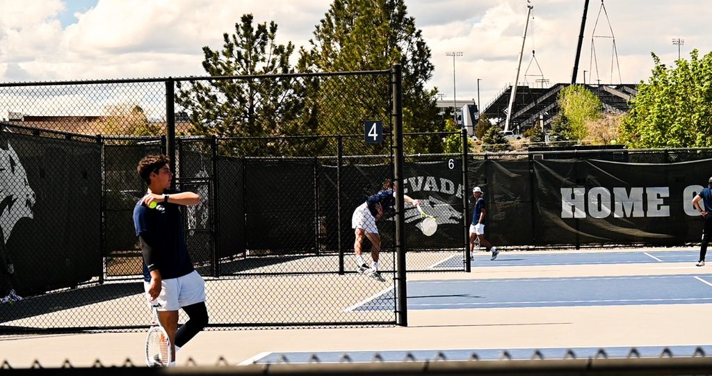 The Nevada men's and women's tennis team warms up at the tennis courts.