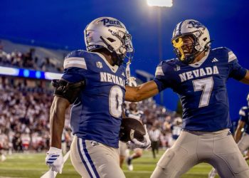 Nevada running back Dom Kelley (#0) celebrates with wide receiver Gary Givens III (#7) after his 72-yard rushing touchdown at Mackay Stadium on Saturday, Sept. 5.