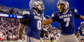 Nevada running back Dom Kelley (#0) celebrates with wide receiver Gary Givens III (#7) after his 72-yard rushing touchdown at Mackay Stadium on Saturday, Sept. 5.