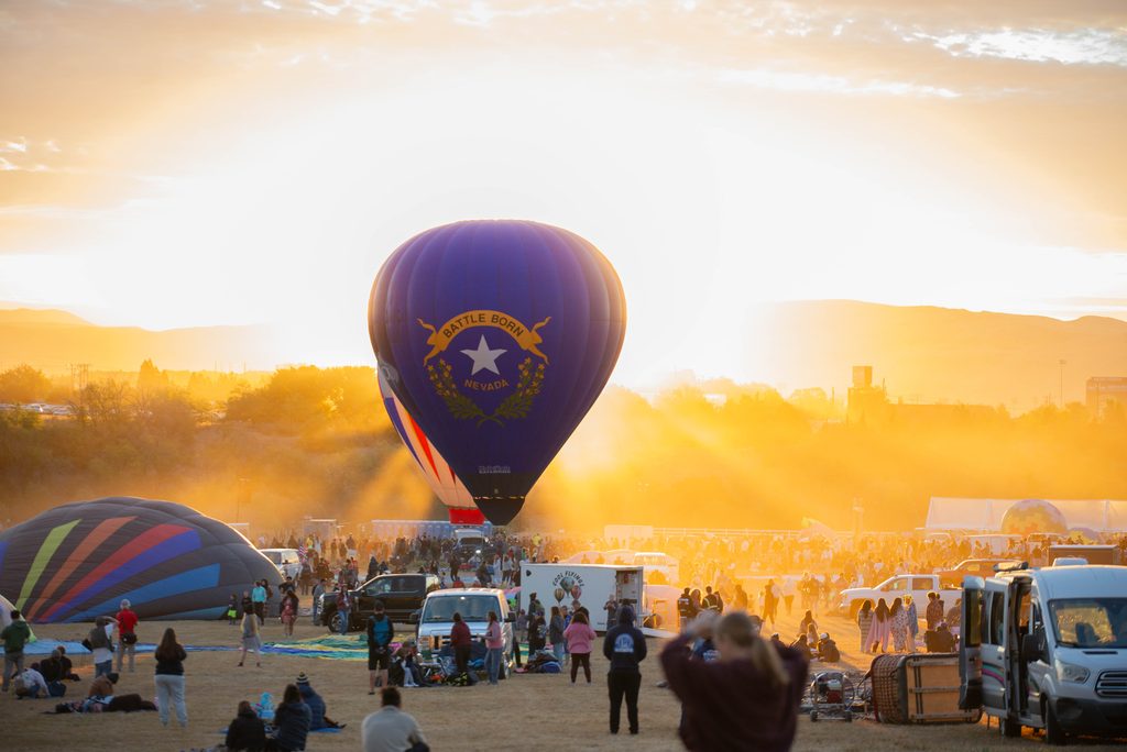 The famous Battle Born balloon, piloted by Pat Irwin, idles on the field in front of the rising sun during the Great Reno Balloon Race on Thursday, Sept. 10.