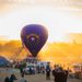 The famous Battle Born balloon, piloted by Pat Irwin, idles on the field in front of the rising sun during the Great Reno Balloon Race on Thursday, Sept. 10.