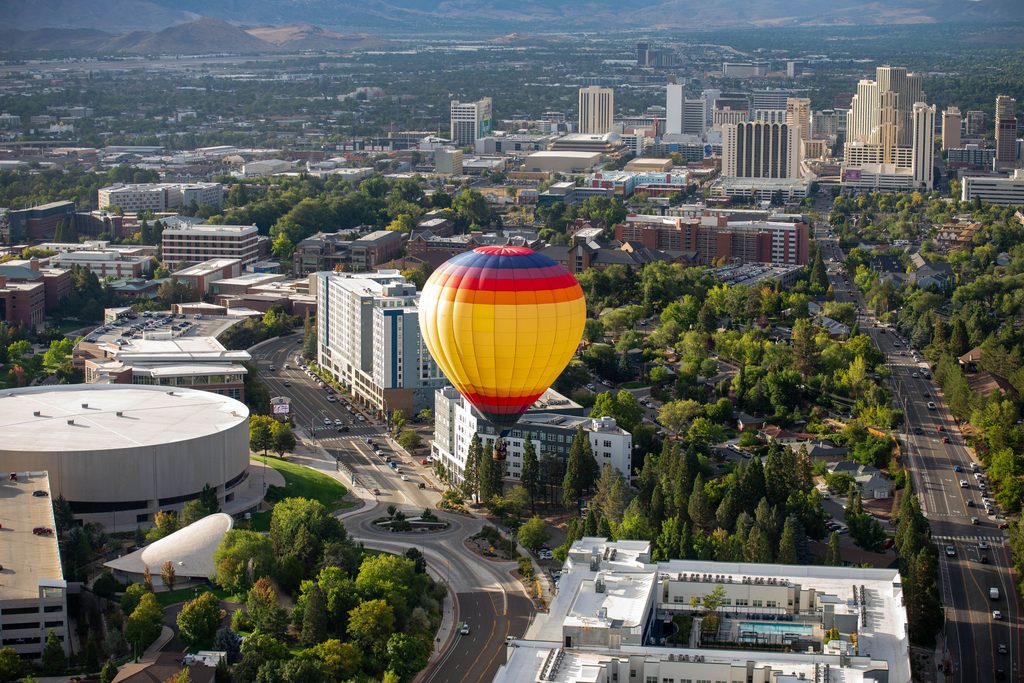 Citrus in the Sky, piloted by Karalyn Mumm, flies over Virginia Street during the Great Reno Balloon Race on Thursday, Sept. 10. 
