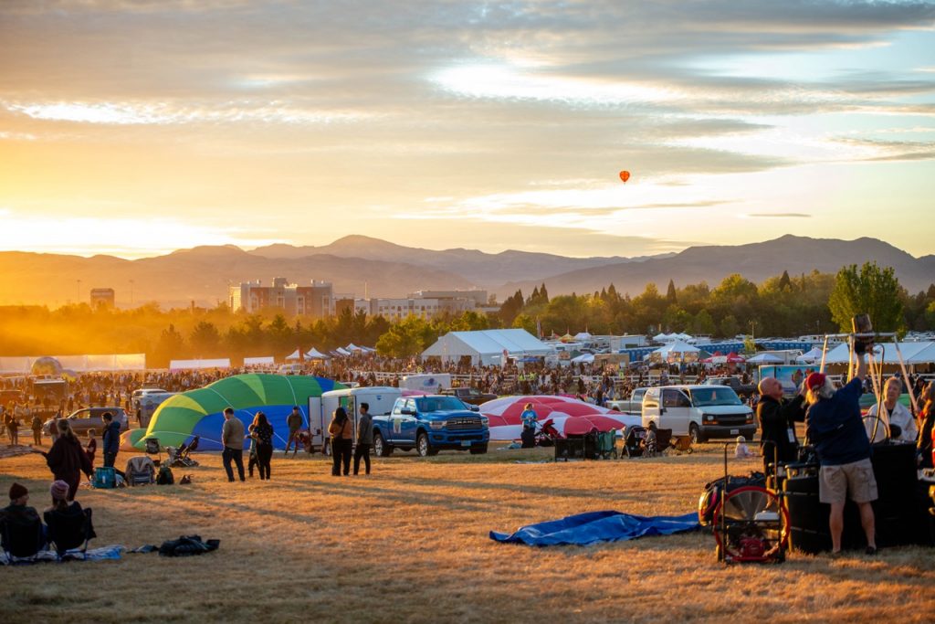 Visitors take in the sunrise at the Great Reno Balloon Festival on Thursday, Sept. 10. (Max Alexander/The Nevada Sagebrush)