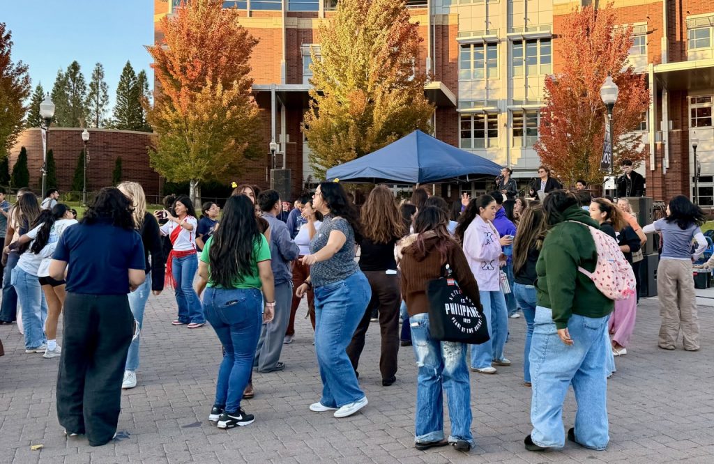 Attendees interacting and dancing to Ritmo Ardiente.