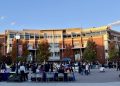 Organizers and attendees participating in Tu Bienvenida at the Joe Crowley Student Union Plaza.