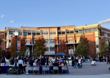 Organizers and attendees participating in Tu Bienvenida at the Joe Crowley Student Union Plaza.