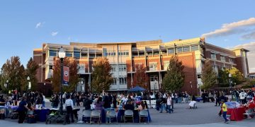 Organizers and attendees participating in Tu Bienvenida at the Joe Crowley Student Union Plaza.