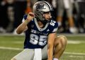 Ewan Baulch, the University of Nevada punter, gets ready to hold a kick.