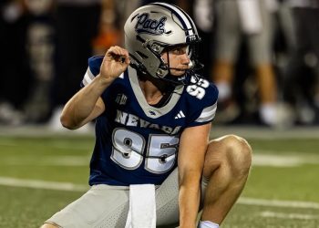 Ewan Baulch, the University of Nevada punter, gets ready to hold a kick.