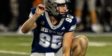 Ewan Baulch, the University of Nevada punter, gets ready to hold a kick.