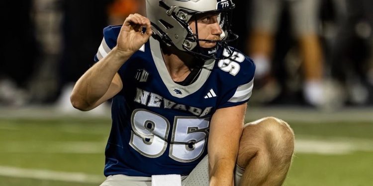 Ewan Baulch, the University of Nevada punter, gets ready to hold a kick.