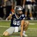 Ewan Baulch, the University of Nevada punter, gets ready to hold a kick.