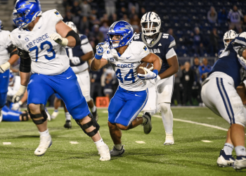 Air Force Academy running back, Rocco Conti, rushes for seven yards in double overtime to win the game at Mackay Stadium on Saturday, Sept. 26.