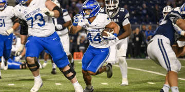 Air Force Academy running back, Rocco Conti, rushes for seven yards in double overtime to win the game at Mackay Stadium on Saturday, Sept. 26.
