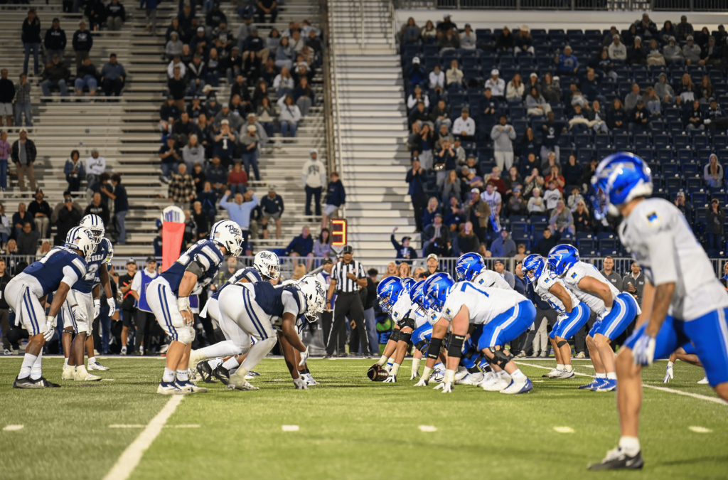 The Wolf Pack defense and the Falcons offense line up for a snap at Mackay Stadium on Saturday, Sept 26. (Peyton Frost/Nevada Sagebrush)
