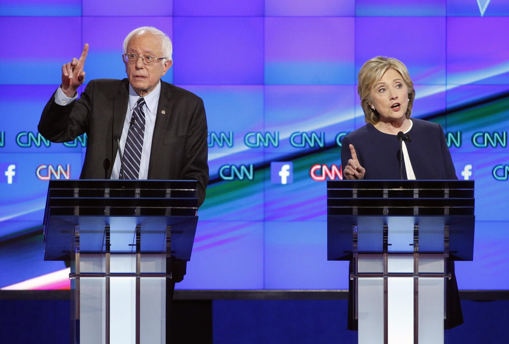 Clinton (right) and Sanders (left) during a primary debate in 2016. (Image courtesy of LA Times)