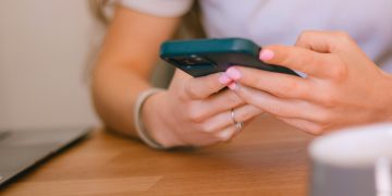 A girl is texting on her phone