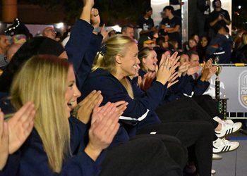 The women’s basketball team cheering on teammate junior guard Aili Tanke in the 3-point contest on Thursday, Oct. 15