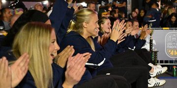 The women’s basketball team cheering on teammate junior guard Aili Tanke in the 3-point contest on Thursday, Oct. 15