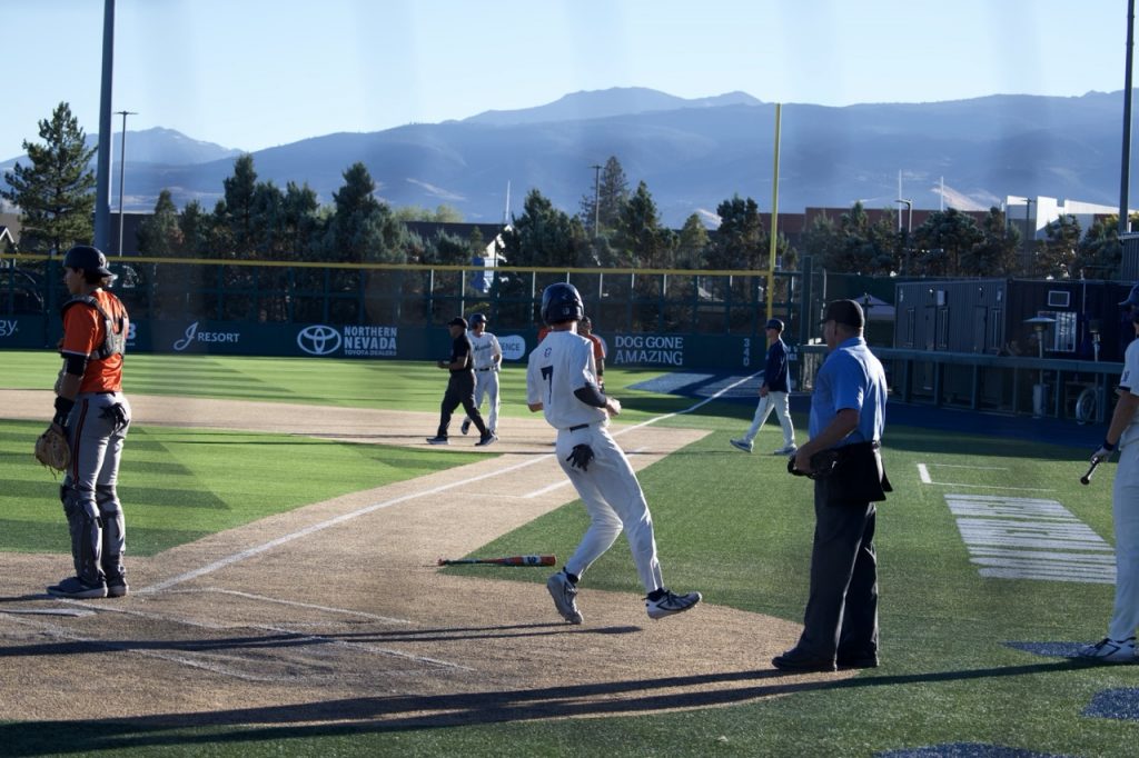 Senior infielder Andrew Grenert crosses home plate on Saturday, Oct. 17