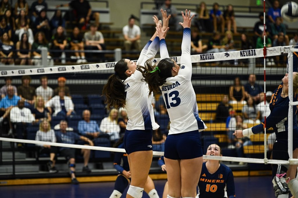 Senior middle blocker Ceren Sert (#7), and freshman setter Adrianna Dorn (#13), close their block
as the opponent comes in with a kill. On Thursday Oct. 8 at The Virginia Street Gym. 