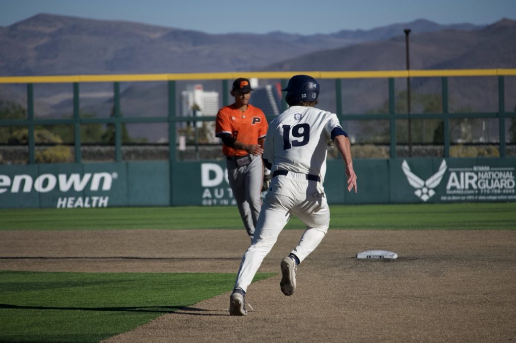 Sophomore infielder Owen Mangini makes a run to second base on Saturday, Oct. 17.