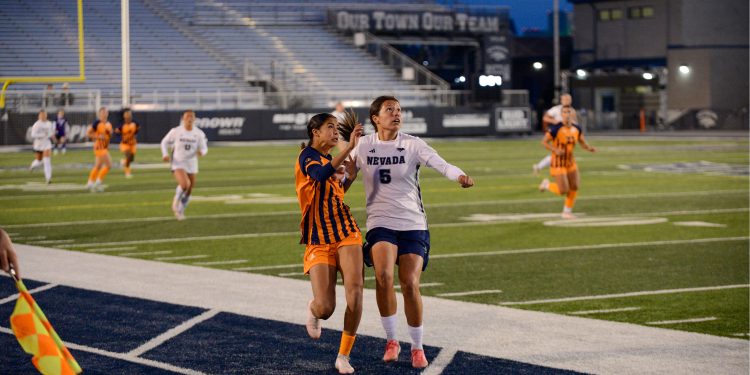 Nevada junior forward Carmen Coronado contests the ball in the air in Nevada's 3-2 win against UTEP at Mackay Stadium on Wednesday, Oct. 28. (Max Alexander/Nevada Sagebrush)