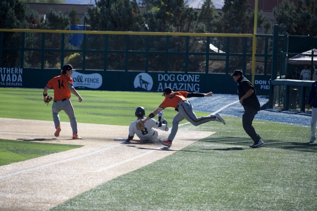 Nevada runner (#8) gets tagged out before he hits first base on Saturday, Oct. 17.