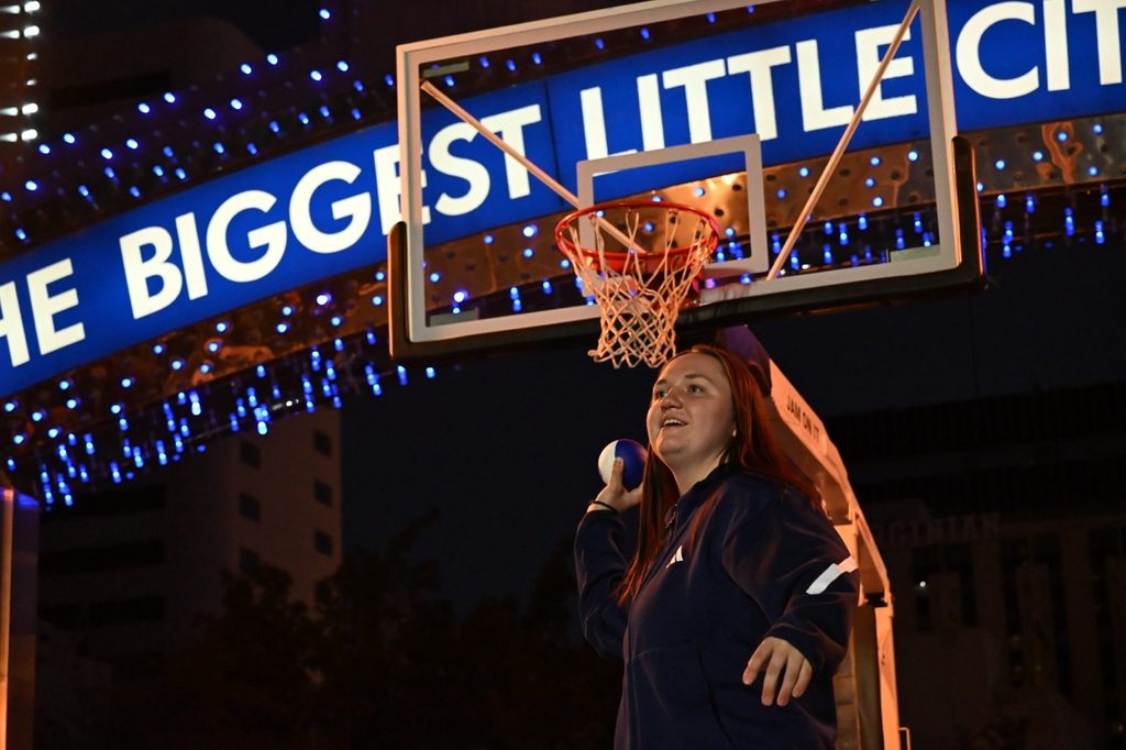 Senior guard Elle Motherway gets ready to toss a foam ball into the crowd.