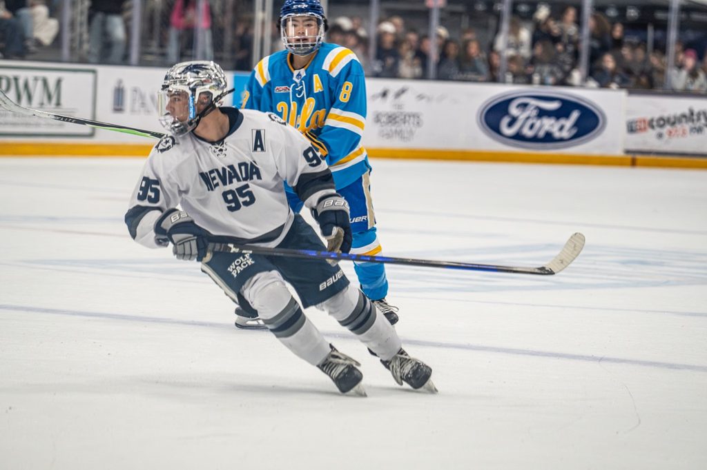 
Nevada hockey player Christopher Lai keeps his eye on the puck as he skates up the ice on Oct. 9 at Reno Ice.