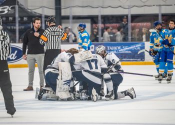 The Nevada men's hockey team gatherson the ice before the game begins on Oct. 9 at Reno Ice.