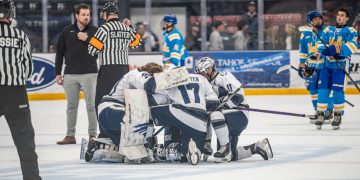The Nevada men's hockey team gatherson the ice before the game begins on Oct. 9 at Reno Ice.