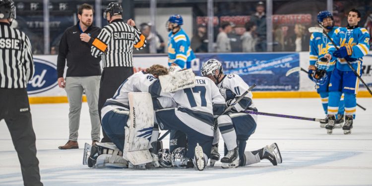 The Nevada men's hockey team gatherson the ice before the game begins on Oct. 9 at Reno Ice.