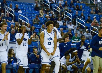 Freshman forward Kade Snyder (#13) celebrates alongside teammates, freshman guard SJ Madison (#15)and freshman forward Hudson Lucas (#11) at Lawlor Event Center on Sunday, Oct. 25.